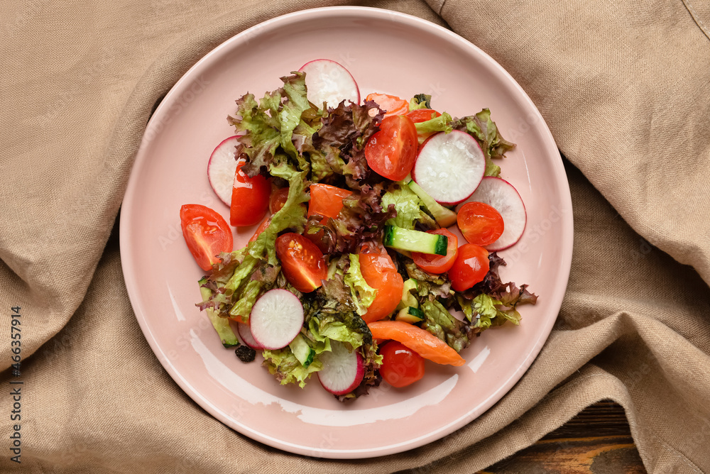 Fresh salad with salmon and vegetables on table Fresh salad with salmon and vegetables on table