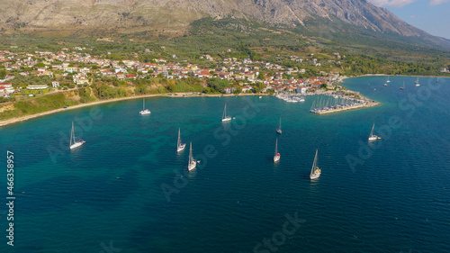 Aerial photo of moored sailing boat at Vathiavali port town in West Greece