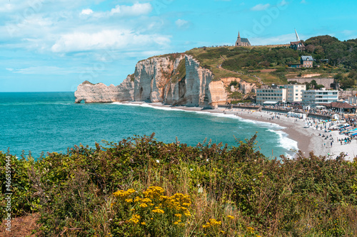 Etretat is best known for its chalk cliffs, including three natural arches and a pointed formation called Aiguille or the Needle