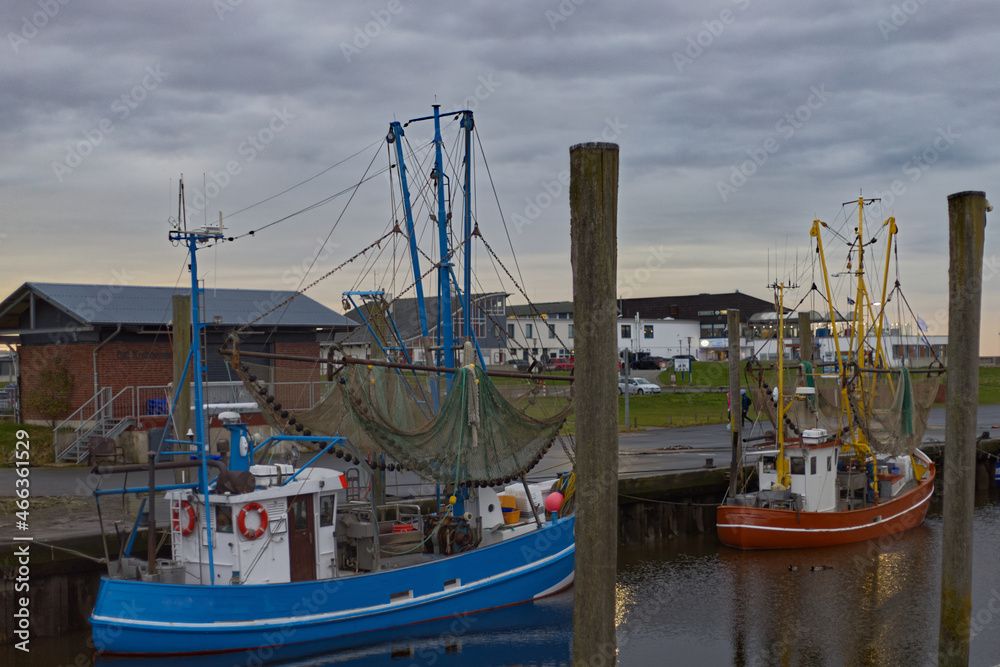 fish trawlers in a port at low tide close to the north sea