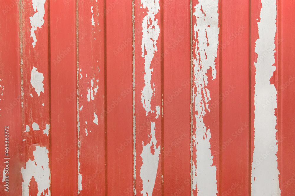 Red peeled old paint abstract pattern with white metal fence surface texture background