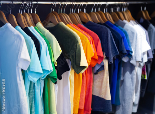 Variety of men clothes in modern garments shop