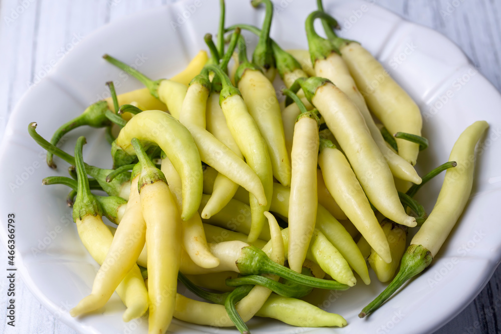 Fresh and organic yellow colored small hot peppers