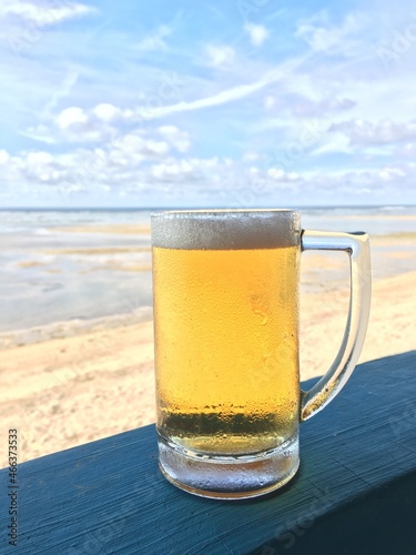 Glass of beer on the beachBolinao, The Philippines 