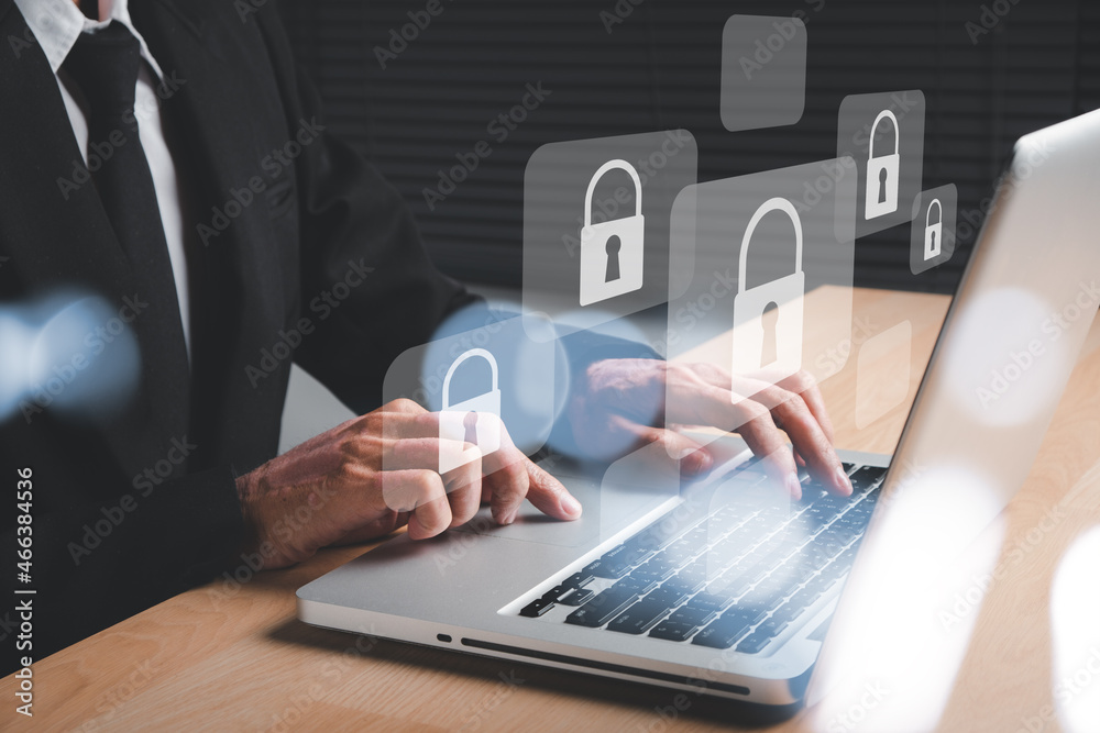 Businessman hand using computer with padlock security interface to protect data, Internet network security concept, Cyber security network, Data protection privacy concept. Businessman hand using computer with padlock security interface to protect data, Internet network security concept, Cyber security network, Data protection privacy concept.