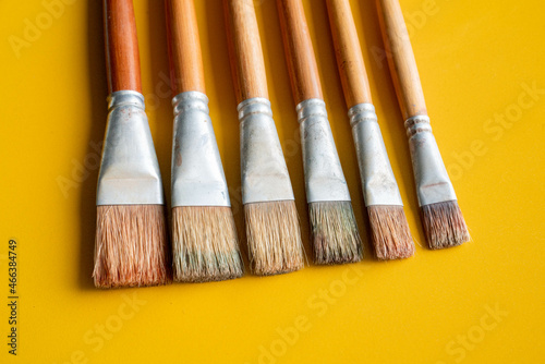 Oil painting brushes yellow blue background art 