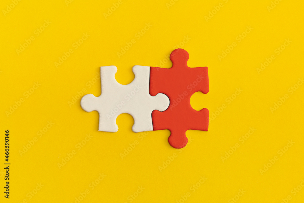 White and red details of puzzle on yellow background. White and red details of puzzle on yellow background.