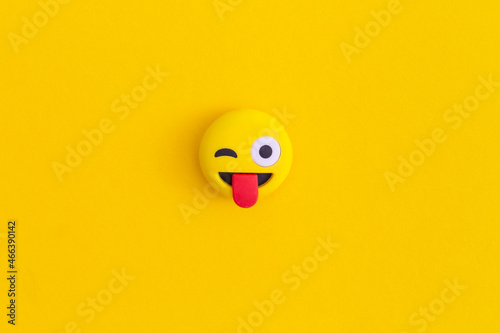 Emoticon smile on a yellow background