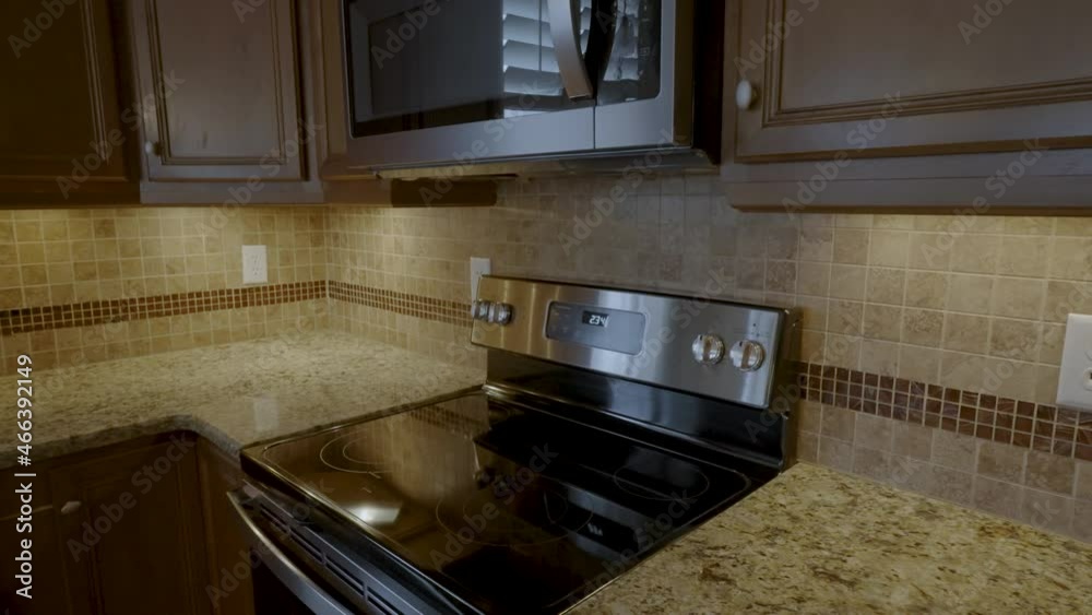 Interior apartment kitchen tracking out from oven Interior apartment kitchen tracking out from oven