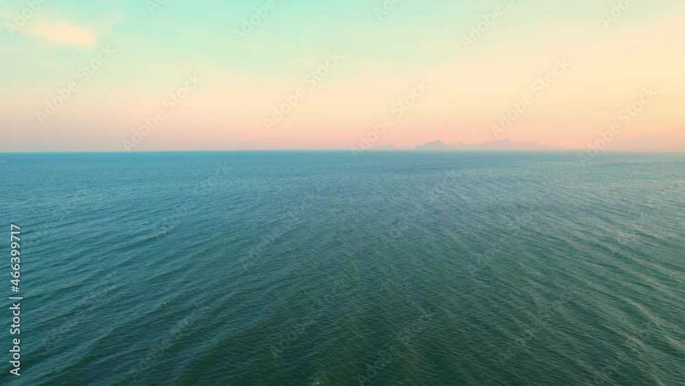 4K Aerial view of drone move on beautiful sea. sunset over ocean waves sand beach. Paradise island of Thailand, Cinematic drone shot.
