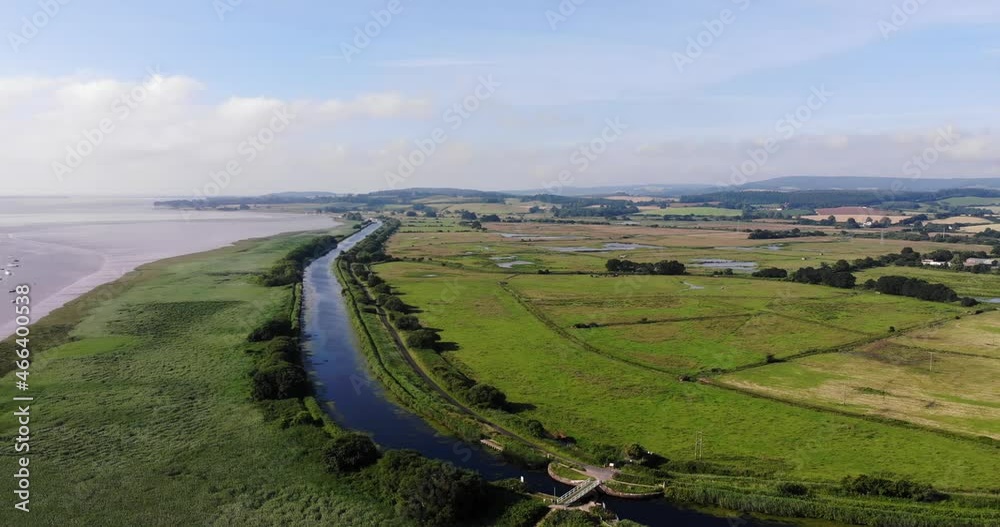 Scenic Aerial View Over Exeter Canal With Slow Pan Left To Reveal Sailboats Anchored In River Exe Scenic Aerial View Over Exeter Canal With Slow Pan Left To Reveal Sailboats Anchored In River Exe