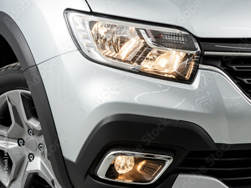 Glowing Headlight of a modern car close-up © Виталий Сова