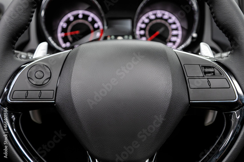 cockpit interior cabin details, speedometer and tachometer. Black leather interior.. photo