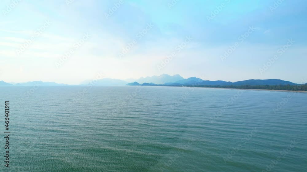 4K Aerial view of drone move on beautiful sea, Flight over ocean. Dynamic aerial shot. Perfect for holiday summer background. Drone 4k shot.
4K Aerial view of drone move on beautiful sea, Flight over ocean. Dynamic aerial shot. Perfect for holiday summer background. Drone 4k shot.