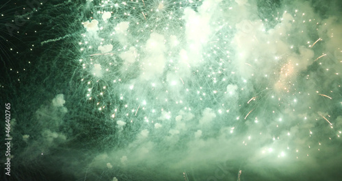 Green Firework celebrate anniversary happy new year 2022, 4th of july holiday festival. Green firework in night time celebrate national holiday. Countdown to new year 2022 festival party time event © aFotostock