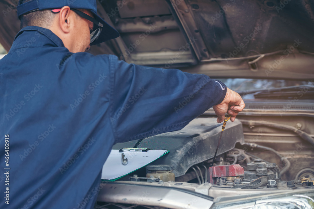 Mechanic car service auto garage in automotive mobile center. Technician workshop repair engine motor vehicles service mechanical engineering business. Automobile mechanic hands car repairs technic Mechanic car service auto garage in automotive mobile center. Technician workshop repair engine motor vehicles service mechanical engineering business. Automobile mechanic hands car repairs technic