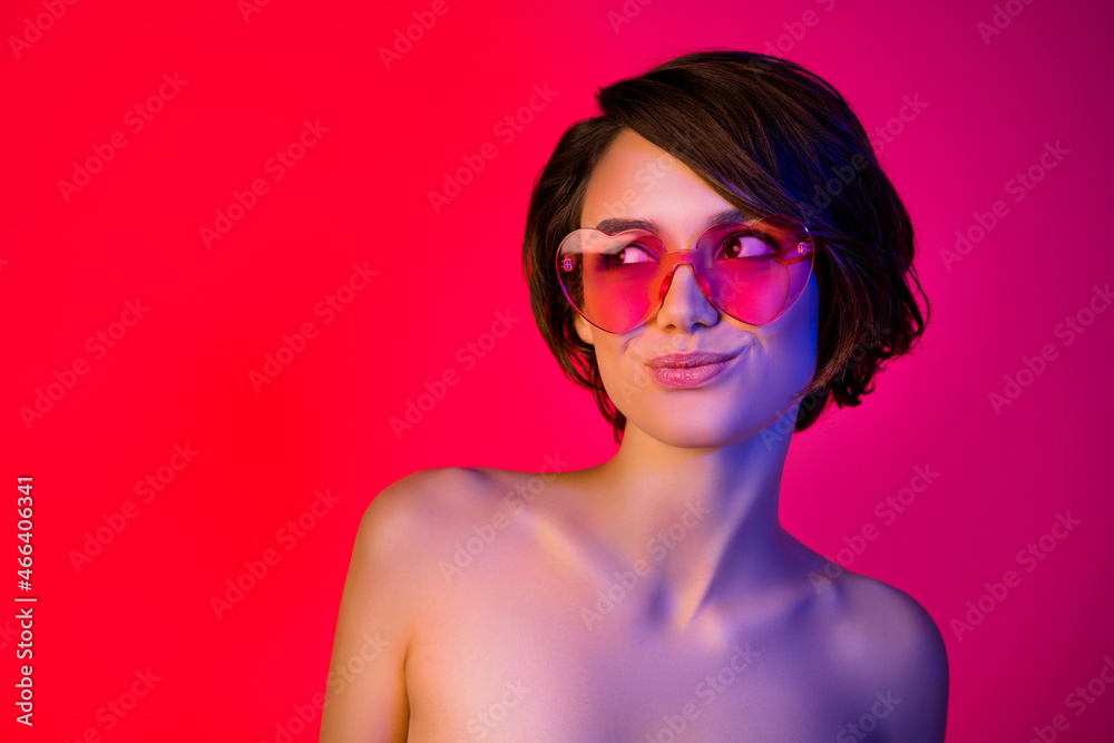 Portrait of attractive cheery girl wearing funky specs copy space idea isolated over bright red multicolor color background Portrait of attractive cheery girl wearing funky specs copy space idea isolated over bright red multicolor color background