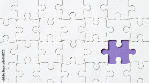 Set of white puzzle pieces and last one piece