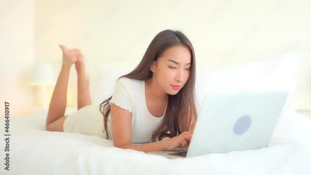 Beautiful Exotic Woman Typing on Laptop Keyboard, Lying on Bed in Bright Bedroom Connecting With Friends, Full Frame Beautiful Exotic Woman Typing on Laptop Keyboard, Lying on Bed in Bright Bedroom Connecting With Friends, Full Frame