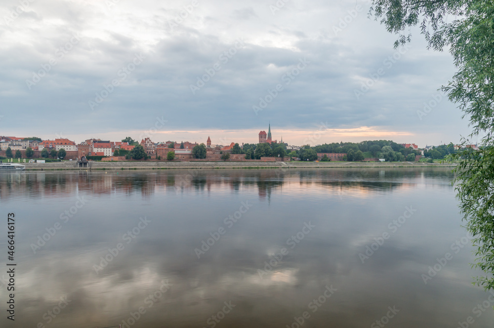 Morning view on panorama of Old Town of Torun seen from the Vistula river in Poland.