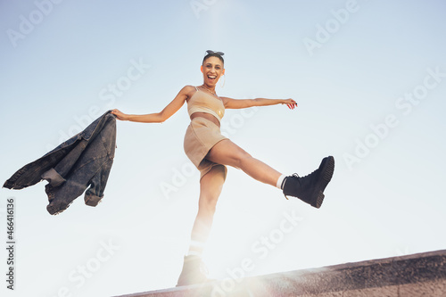 Canvas Print Woman kicking the air outdoors