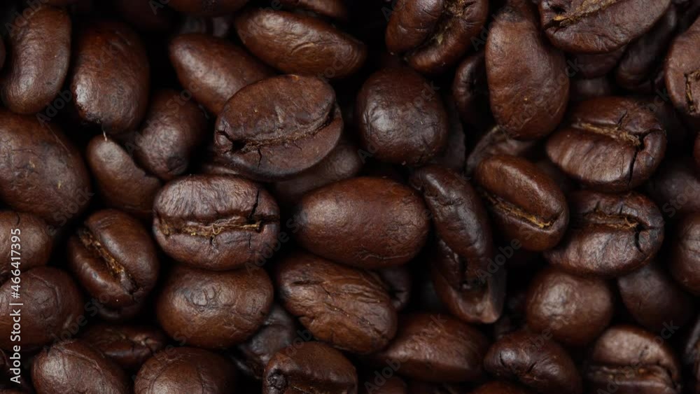 close up of roasted coffee beans rotating, seeds of coffee close up of roasted coffee beans rotating, seeds of coffee