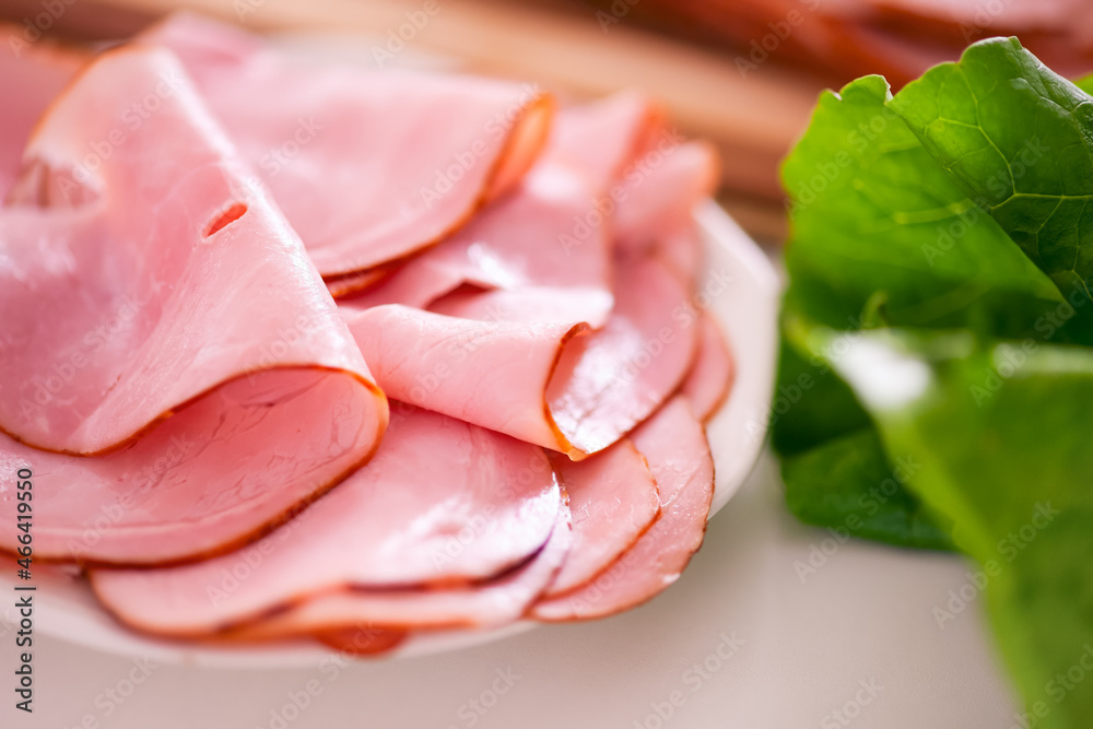 Ham slices on a white plate