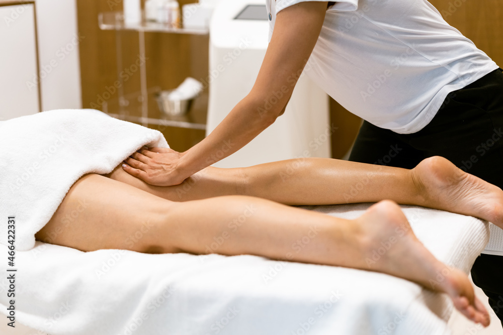 Fototapeta premium Middle-aged woman having a leg massage in a beauty salon.