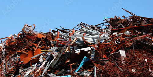 pile of rusted ferrous scrap in a landfill by a foundry photo