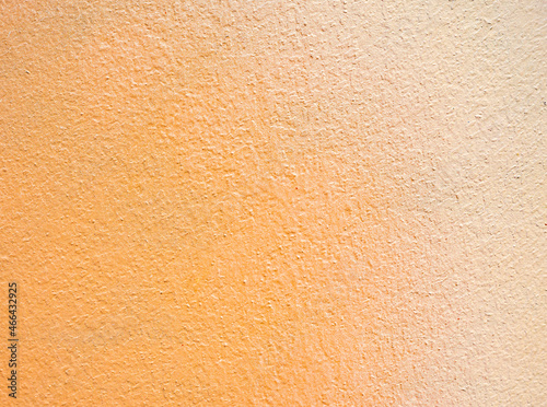 Orange color cement wall texture background 