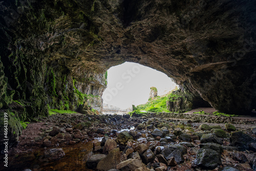 Smoo Cave is a large combined sea cave and freshwater cave in Durness in Sutherland, Highland, Scotland. The cave name is thought to originate from the Norse 'smjugg' or 'smuga', meaning a hole or hid