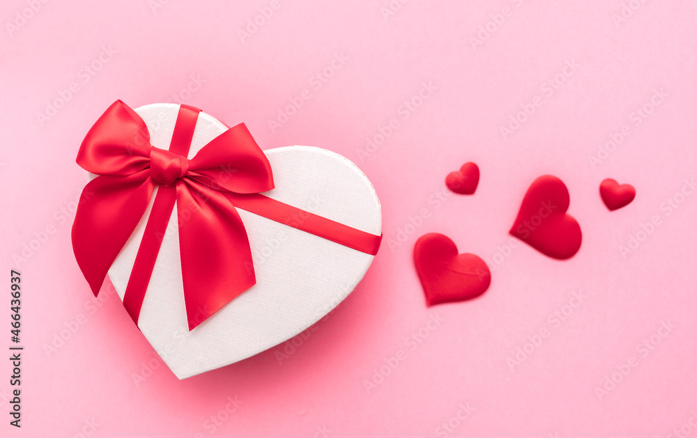 Love Valentine's Day. Love background. Gifts in the form of hearts on a pink background with the inscription love. Copy space for text. The concept of romance and love. square format. word Love Valentine's Day. Love background. Gifts in the form of hearts on a pink background with the inscription love. Copy space for text. The concept of romance and love. square format. word