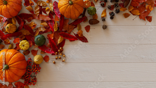 Top down view of White wood Tabletop with leaves, Pumpkins and Acorns. photo
