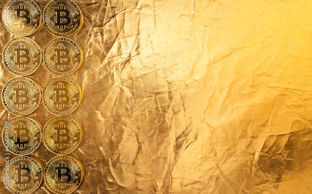 Naklejka premium gold bitcoin on gold background