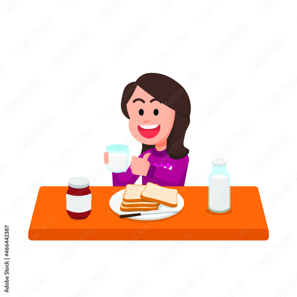 Happy little girl has breakfast with milk and bread Happy little girl has breakfast with milk and bread