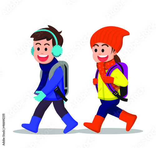 Cheerful children walk together to school in winter