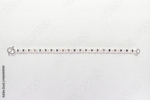 Silver bracelet on white background photo