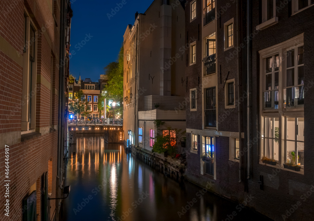 Night Canal Between Amsterdam Houses