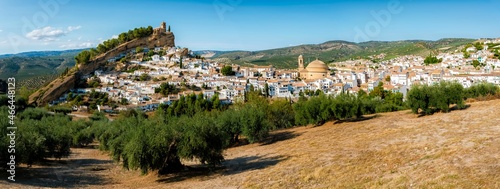 View from the National Geographic viewpoint of  Montefrio, with the round church of the Incarnation and the castle and church of the village on topsurrounded by whitewashed houses and olive fields. photo