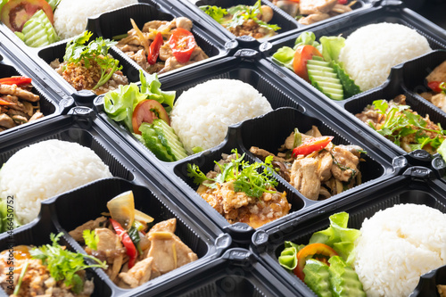 Modern Thai food lunch boxes in plastic packages.