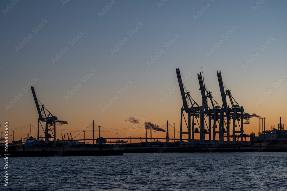 Köhlbrandbrücke with cranes of a container terminal in Hamburg in the evening