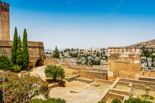 Alhambra palace complex in the foreground and city of Granada in the background, Spain