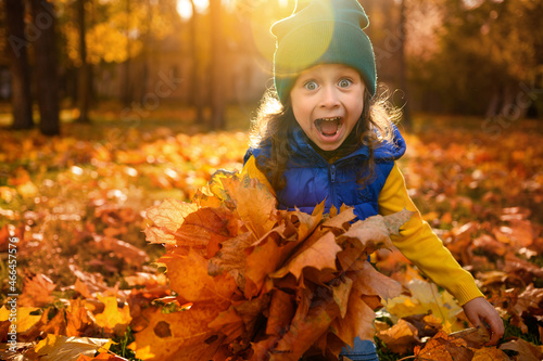 Fotografie Emotional lifestyle portrait of adorable cheerful baby girl in colorful clothes