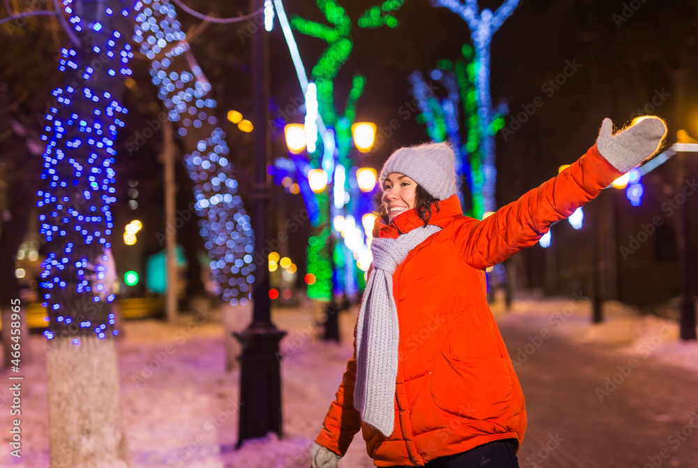 Young pretty funny girl having fun outdoor in winter. Christmas, city and winter holidays concept. Young pretty funny girl having fun outdoor in winter. Christmas, city and winter holidays concept.