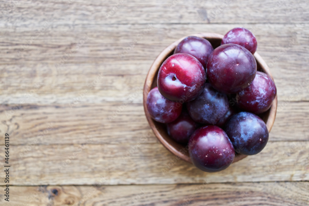 plums fruits natural products on a wooden table top view plums fruits natural products on a wooden table top view