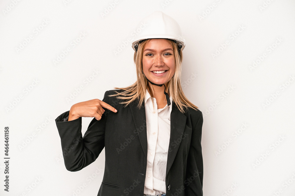 Young caucasian architect woman wearing a helmet isolated on white background person pointing by hand to a shirt copy space, proud and confident Young caucasian architect woman wearing a helmet isolated on white background person pointing by hand to a shirt copy space, proud and confident