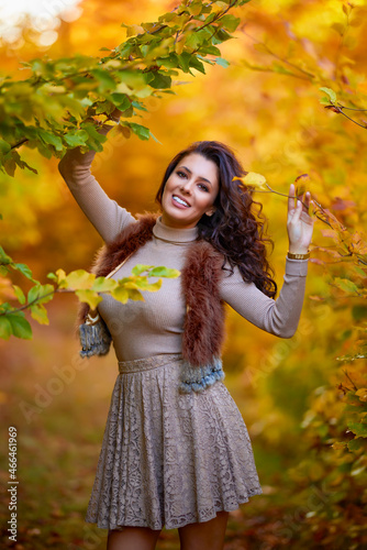 portrait of a beautiful woman in the woods in autumn season