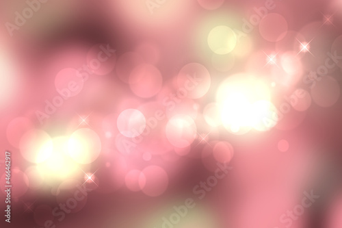 A festive abstract orange pink yellow gradient background texture with glitter defocused sparkle bokeh circles. Card concept for Happy New Year, party invitation, valentine or other holidays.