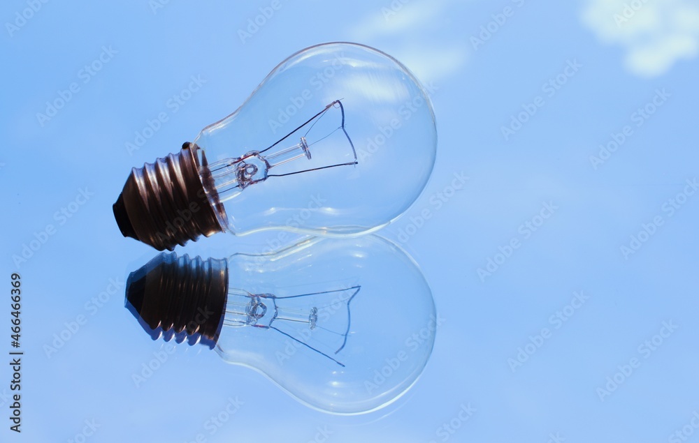light bulb with reflection white clouds sky background renewable energy nature and environment concept light bulb with reflection white clouds sky background renewable energy nature and environment concept