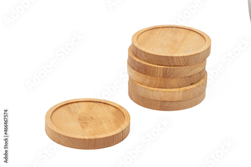 Round wooden coasters isolated above white background